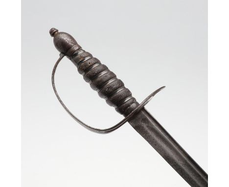 With a 67cm curved pointed blade with twin fullers, the upper fuller narrower. With a steel slotted guard and rounded squared