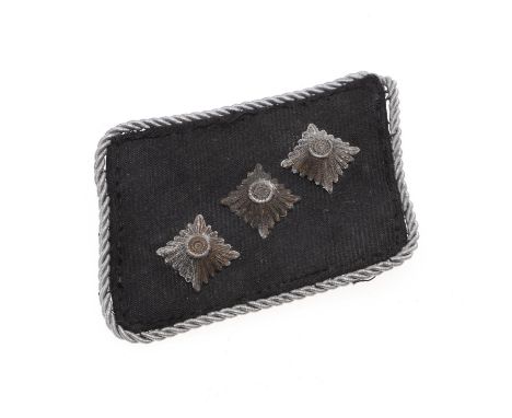 A late war production rank patch with three white metal pips and silver wire border against a black ground. Probably removed 