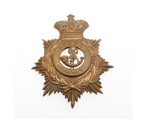 A Durham Light Infantry Helmet plate c.1889-1901, stamped brass with a Queen's Crown above a laurel mounted star with detacha