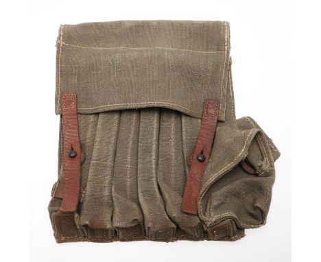 A German ammunition pouch for six sub-machine gun magazines and a loading tool, possibly for the Schmeister M40. In Olivedrab