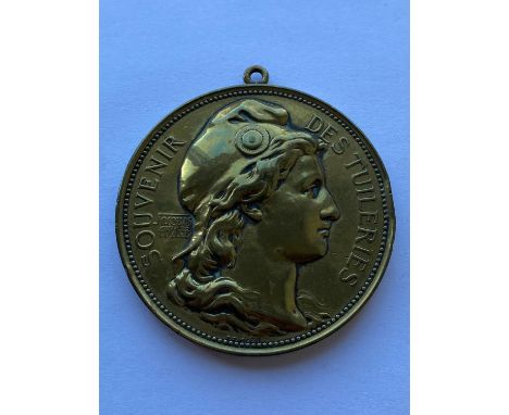 A gilt bronze medal 'Souvenir Des Tuileries', obverse with a portrait of 'Marianne' in a soft cap, signed beneath the bust Er