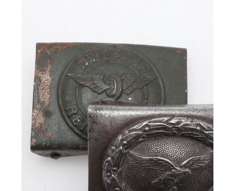 A Deutsche Reichsbahn, German National Railway, with green paint over a pebble ground, ans a similar Luftwaffe buckle with wi