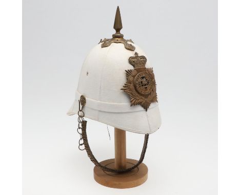 With a brass hexagonal spike finial with four flower-head mounts and South Wales Borderers Helmet Plate with Queen's crown ab