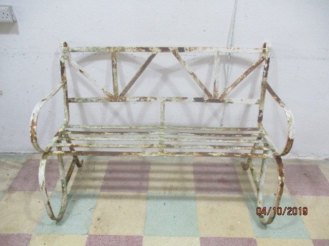 A wrought iron garden seat