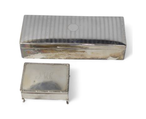A George V silver mounted rectangular cigarette box, London, 1926, 25.9cm, together with an Edwardian silver mounted cigarett