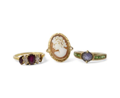 A late 1970's 18ct gold three stone ruby and two stone diamond set ring (one ruby missing), size N/O, gross weight 2.7 grams 