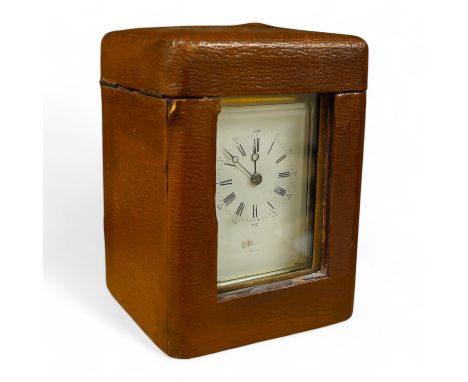 A French brass cased repeating carriage clock, striking on a bell, with key and case, 16cm high. Condition - fair, untested