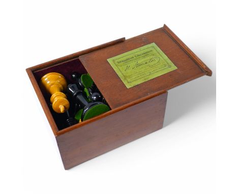 An early 20th century boxed J. Jaques & Son Staunton chess set, ebony and boxwood pieces, contained within the original velve