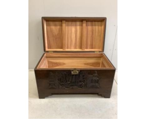 A Chinese carved camphorwood trunk, width 100cm, depth 55cm, height 57cm. Condition - fair