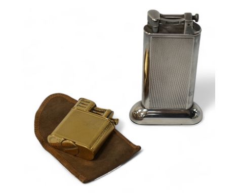 Two Dunhill lighters to include a plated table lighter, largest 10cm high. Condition - fair to good, not working