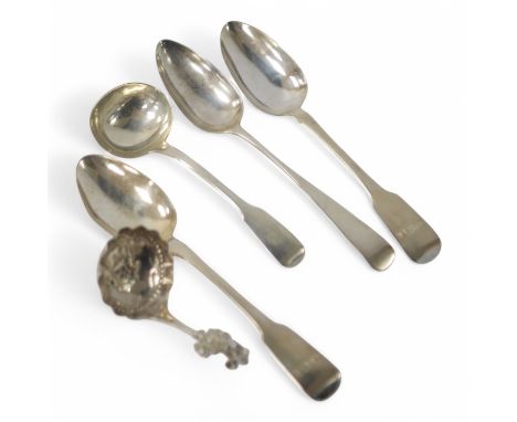 A late 19th century continental silver caddy spoon, with figural terminal, import marks for Sheffield, 1894, together with fo