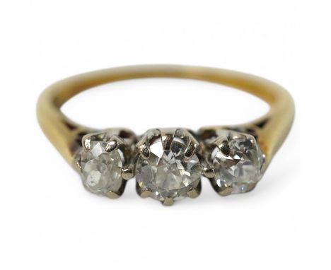An 18ct gold and three stone diamond set ring, size K, gross weight 2.4 grams. Condition - fair to good