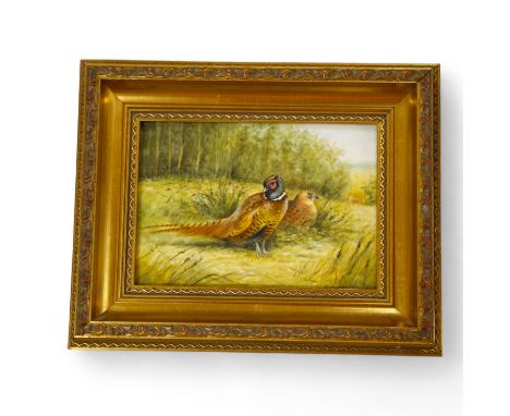 A Royal Worcester framed porcelain plaque decorated with game birds, signed T. Nutt (Terry Nutt), 12 x 17cm. Condition - good