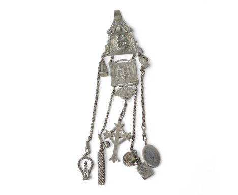 A late 19th/early 20th century continental white metal chatelaine, hung with six assorted accoutrements including a small sil