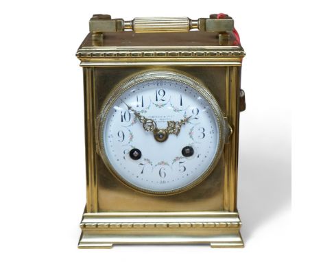 A late 19th century French brass large carriage clock with convex enamel dial, retailed by Robinson &amp; Co. with key, 17cm.