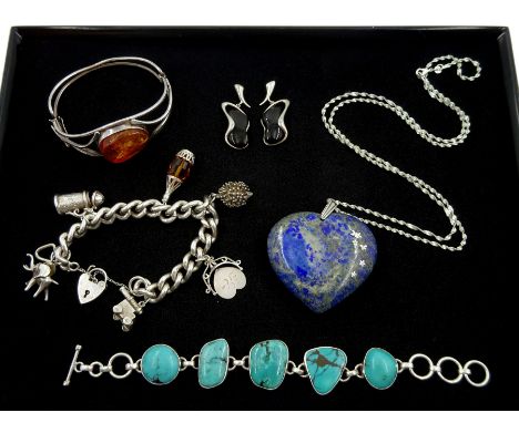 Silver curb link bracelet with charms including elephant and hedgehog, pair of silver jet stud earrings, silver amber bangle,