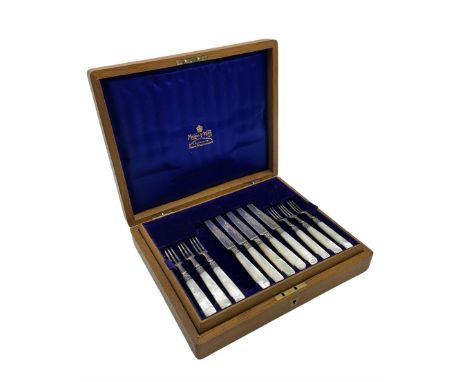 Set of eleven silver bladed dessert knives and twelve forks with mother of pearl handles in original oak case Sheffield 1912 