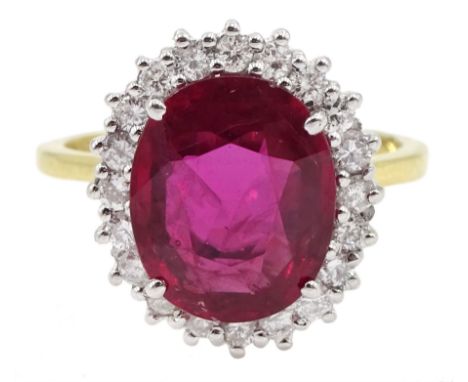 18ct gold oval ruby and round brilliant cut diamond cluster ring, hallmarked, ruby 3.85 carat, total diamond weight approx 0.