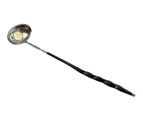 Georgian punch ladle, the oval bowl with inset gold coin and on twisted whalebone handle