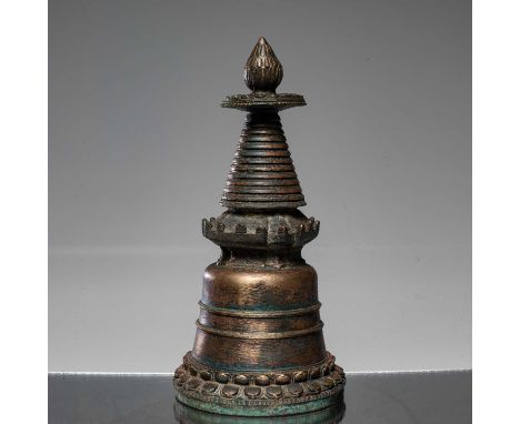 Dimensions: Height 25 cm Wide 12 cm Depth 12 cm Weight: 1420 grams Tibetan bronze stupa from the 19th century. Its design fea