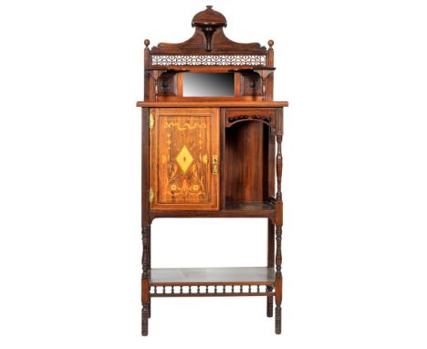 A late Victorian rosewood salon side cabinet, the fret-cut upright panel with central mirror above an offset cupboard and str