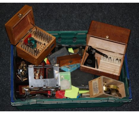 A collection of clockmakers tools and accessories to include clamps, vices, cased instruments watch dials and spares (qty)