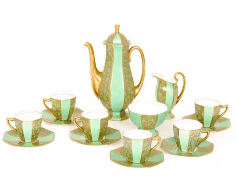 A 1930s Art Deco Royal Doulton coffee service comprising pedestal coffee pot, milk jug, sugar bowl and six cans and saucers d