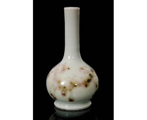 A miniature Chinese vase of footed globe and shaft form decorated with three hand painted outlines of dogs in flambe red walk