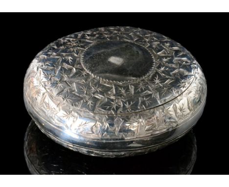 A late Victorian hallmarked silver squeeze action circular snuff box with engraved ivy leaf decoration, the hinged lid openin