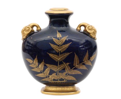 A late 19th Century Royal Worcester Aesthetic pillow vase decorated with gilt ferns and foliage against a royal blue ground w