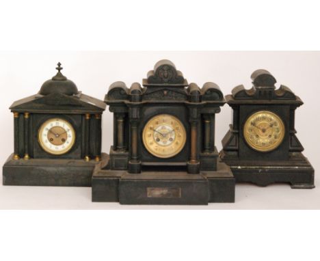 A Victorian black slate mantle clock of domed architectural form and pillared front together with two slate mantle clocks (3)