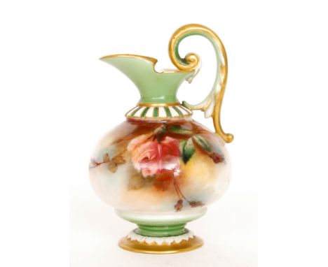 A small Royal Worcester Hadley Ware pedestal jug panel decorated with roses and foliage, the foot and neck in pea green with 