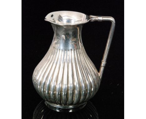 A Victorian hallmarked silver cream jug of baluster form with fluted decoration, weight 2.7oz, height 8cm, Birmingham 1871 Ha