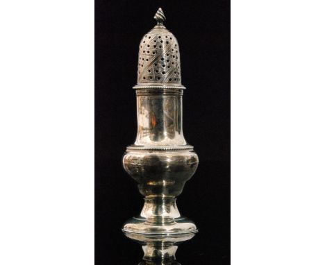 A George III hallmarked silver castor of baluster form and beaded borders with pierced cover with flame finial on domed colle