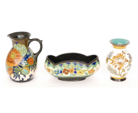 Three pieces of assorted Gouda comprising a floral decorated jug S/D, a Chrysanthemum pattern vase and an oval planter S/D, a