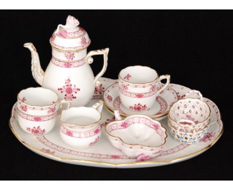 A Herend cabaret set comprising coffee pot, two coffee cans and saucers, milk jug and a sugar bowl upon an oval tray, all dec
