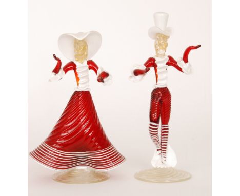 A pair of post war Italian Murano glass figures of a dandy and his lady in stylised ruby costume with applied white trim, unm