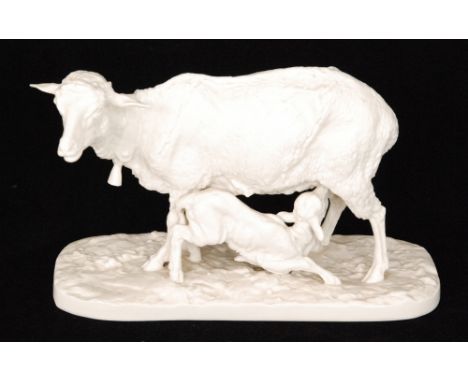 A late 19th Century blanc de chine model as a goat stood on a naturalistic base with a kid goat suckling, impressed shield ma