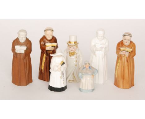 A Royal Worcester candle snuffer modelled as a young boy wearing an oversized long coat and top hat, after designs by Kate Gr