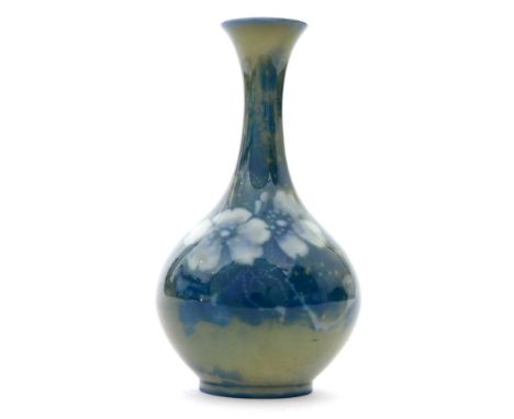 An early 20th Century Royal Worcester Sabrina Ware vase of globe and shaft form decorated with flowers and foliage against a 