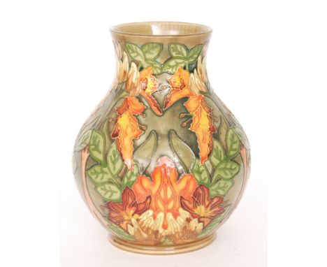 A Moorcroft Pottery vase decorated in the Flame of the Forest pattern designed by Phillip Gibson, impressed and painted marks