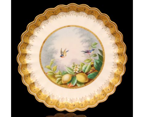 A late 19th Century Copeland Spode cabinet plate decorated with a hand painted scene of two colourful birds in flight above l