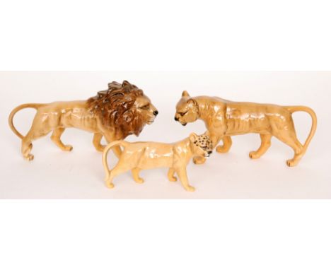 Three Beswick Wild Animals comprising a Lion (facing right) model 1506, a Lioness model 1507 and a Lion Cub model 1508, all w