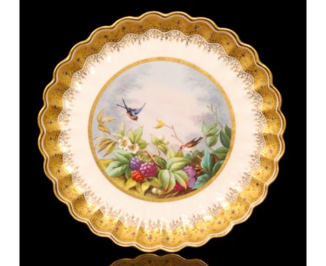 A late 19th Century Copeland Spode cabinet plate decorated with a hand painted scene of two colourful birds in flight above b