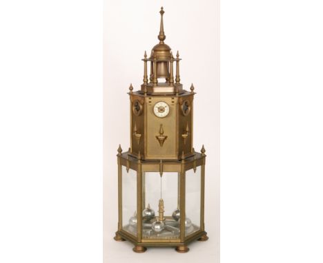 A 20th Century replica brass lighthouse or lantern torchon clock with striking movement and small dial over a glazed octagona