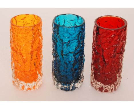 Three Geoffrey Baxter for Whitefriars Textured range cylindrical bark vases, pattern No 9690 in Tangerine, Ruby and Kingfishe