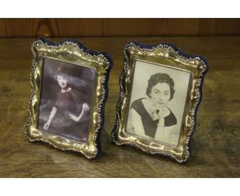 Pair of Elizabeth II silver picture frames, Sheffield 1990, maker Mappin and Webb, with scroll decorated borders and easel ba