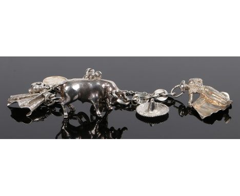 Spanish silver charm bracelet, with a bull and bull fighter a hat and cloak, together with a Mallorca medallion attached, tot