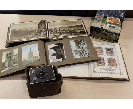 Two postcard and snapshot albums, cigarette card album, loose cigarette cards, box brownie camera (qty)