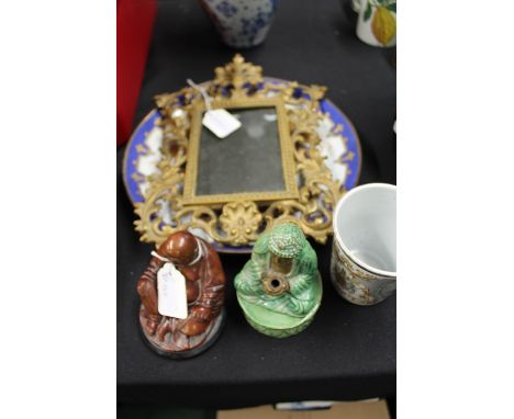 Seated buddha incense burner, the pottery buddha holding a bowl above a platform base, 12.5cm high together with another budd
